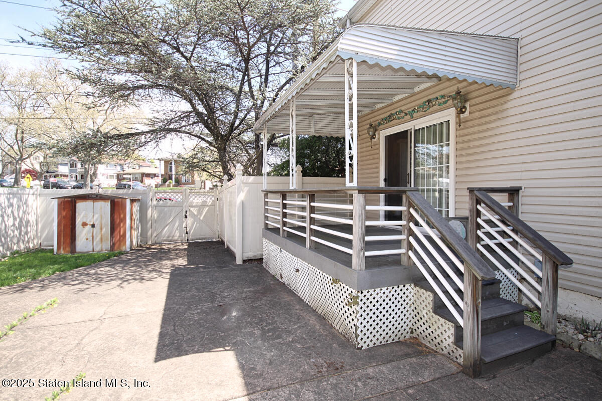 3 Windermere Road Staten Island, NY 10305 - Photo 33 of 37 a view of house with backyard and trees
