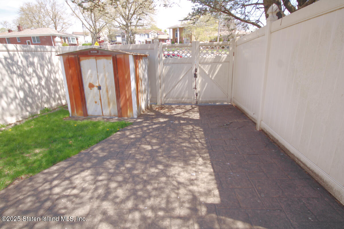 3 Windermere Road Staten Island, NY 10305 - Photo 36 of 37 a view of a yard with wooden fence