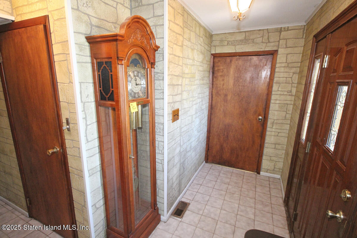 3 Windermere Road Staten Island, NY 10305 - Photo 4 of 37 a view of front door with a mirror