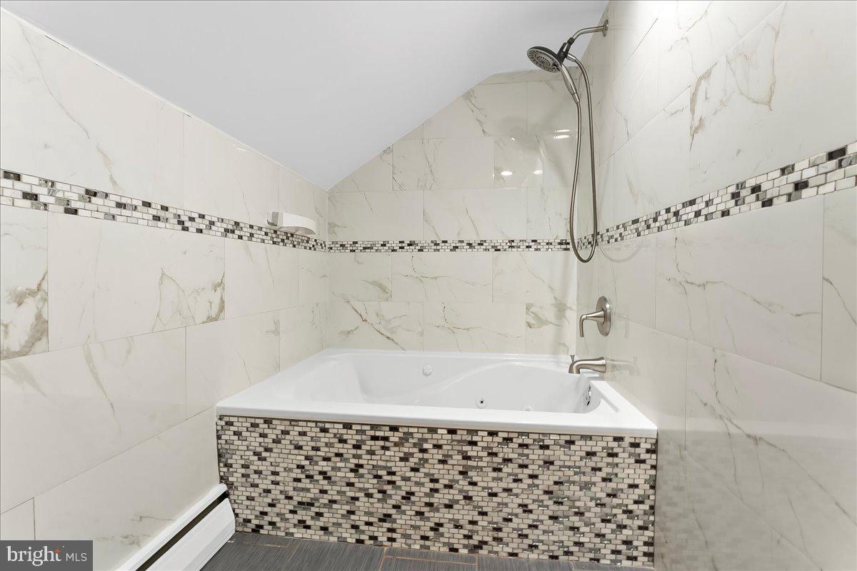 200 North State Road Springfield, PA 19064 - Photo 22 of 46 a bathroom with a bathtub and shower