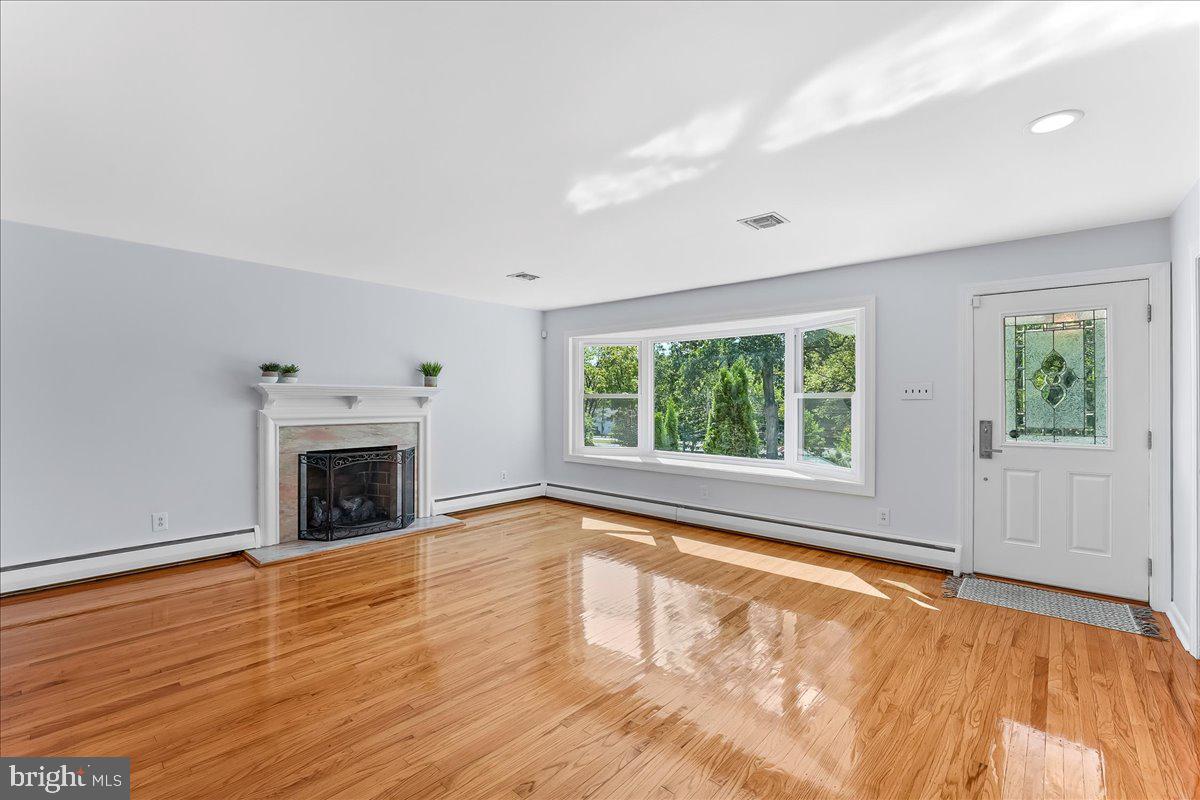 200 North State Road Springfield, PA 19064 - Photo 3 of 46 a view of empty room with wooden floor and fan