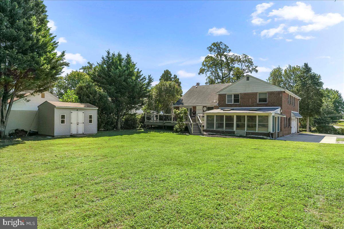 200 North State Road Springfield, PA 19064 - Photo 36 of 46 a front view of house with yard and trees in the background