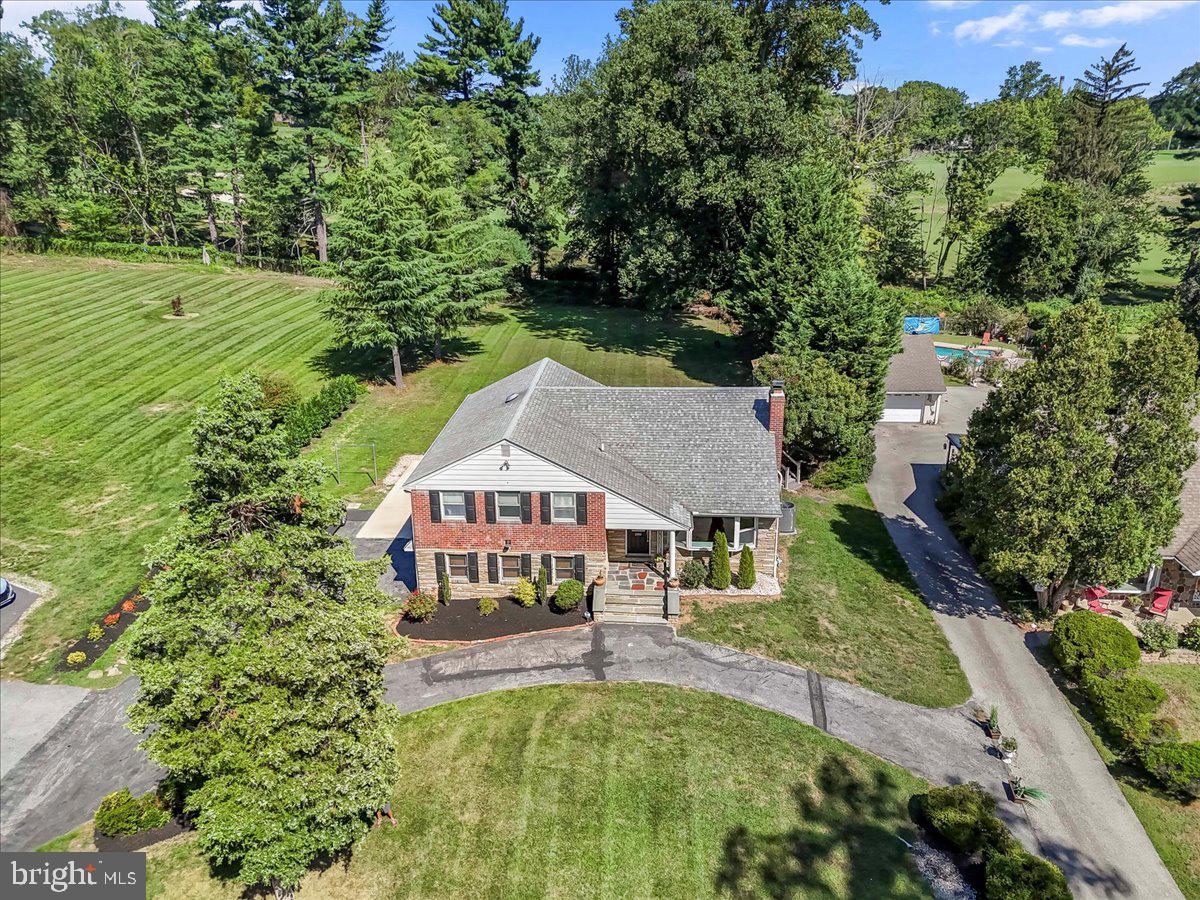200 North State Road Springfield, PA 19064 - Photo 39 of 46 an aerial view of a house with swimming pool and garden
