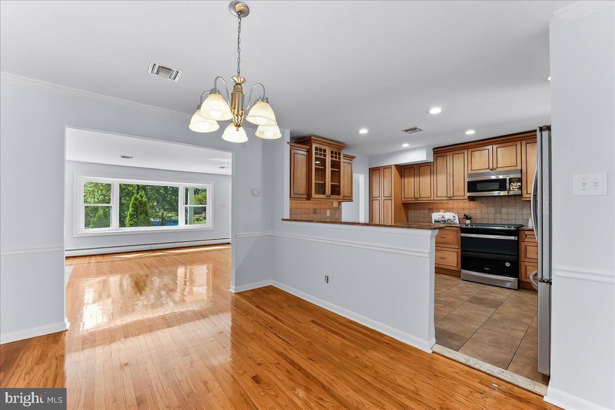 200 North State Road Springfield, PA 19064 - Photo 9 of 46 a kitchen with wooden floor and a window