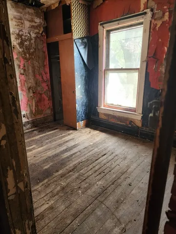 a view of empty room with windows