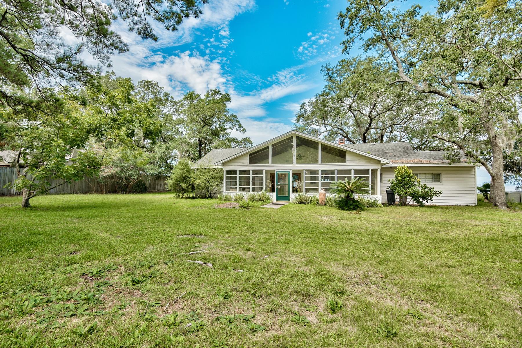 2476 Bay Grove Road Freeport, FL 32439 - Photo 3 of 27 a front view of a house with a yard