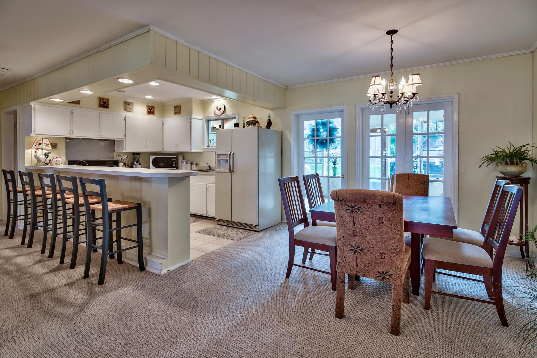 2476 Bay Grove Road Freeport, FL 32439 - Photo 8 of 27 a view of a dining room with furniture and chandelier