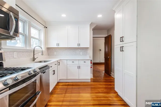 a kitchen with a stove and a refrigerator