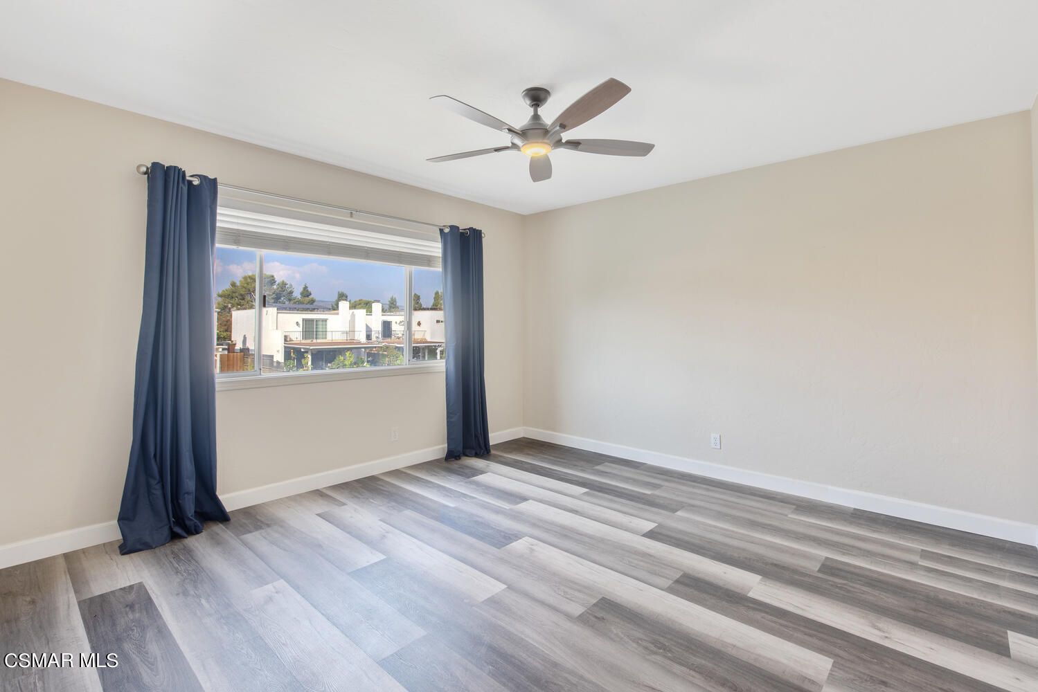 1657 Dockside Lane Camarillo, CA 93010 - Photo 19 of 22 a view of a livingroom with wooden floor and a ceiling fan