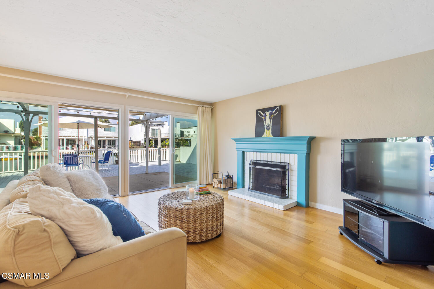 1657 Dockside Lane Camarillo, CA 93010 - Photo 3 of 22 a living room with furniture a flat screen tv and a fireplace