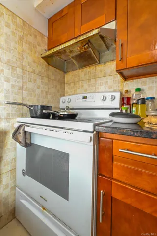 a view of a kitchen with dining table and chairs