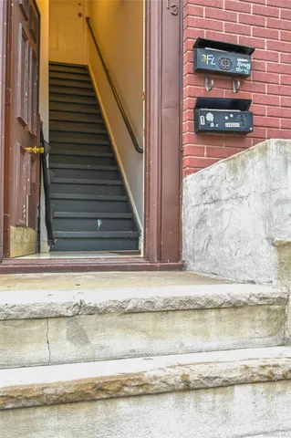 a front view of a house with parking space