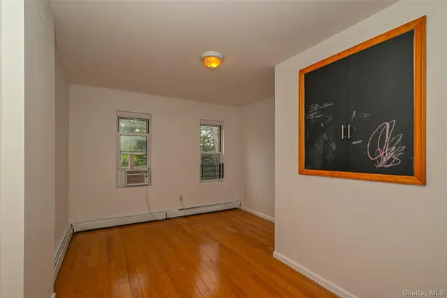 a view of wooden floor in an empty room