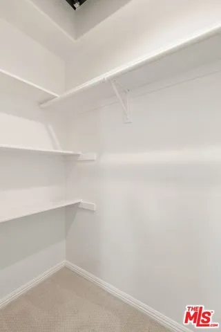 a hallway with cabinet