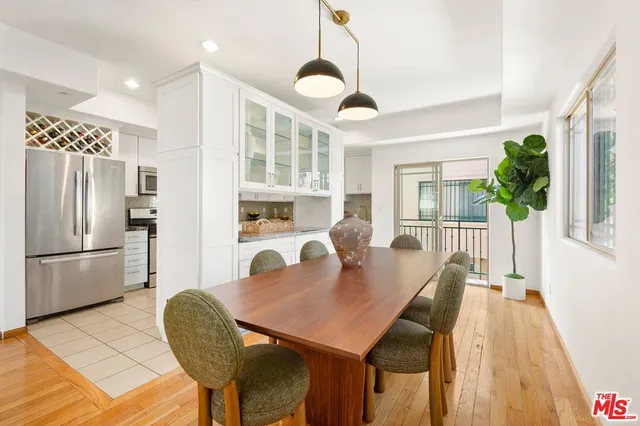 a view of a dining room with furniture and a window