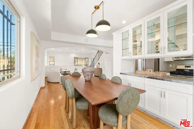 a view of a dining room with furniture and wooden floor