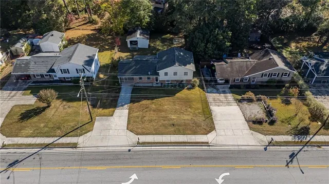 a view of a swimming pool with sitting area and seating area