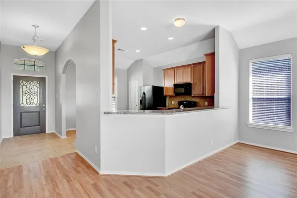 a view of a kitchen cabinets and wooden floor