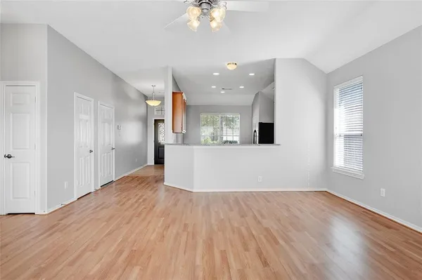 a view of a kitchen with a sink and a window