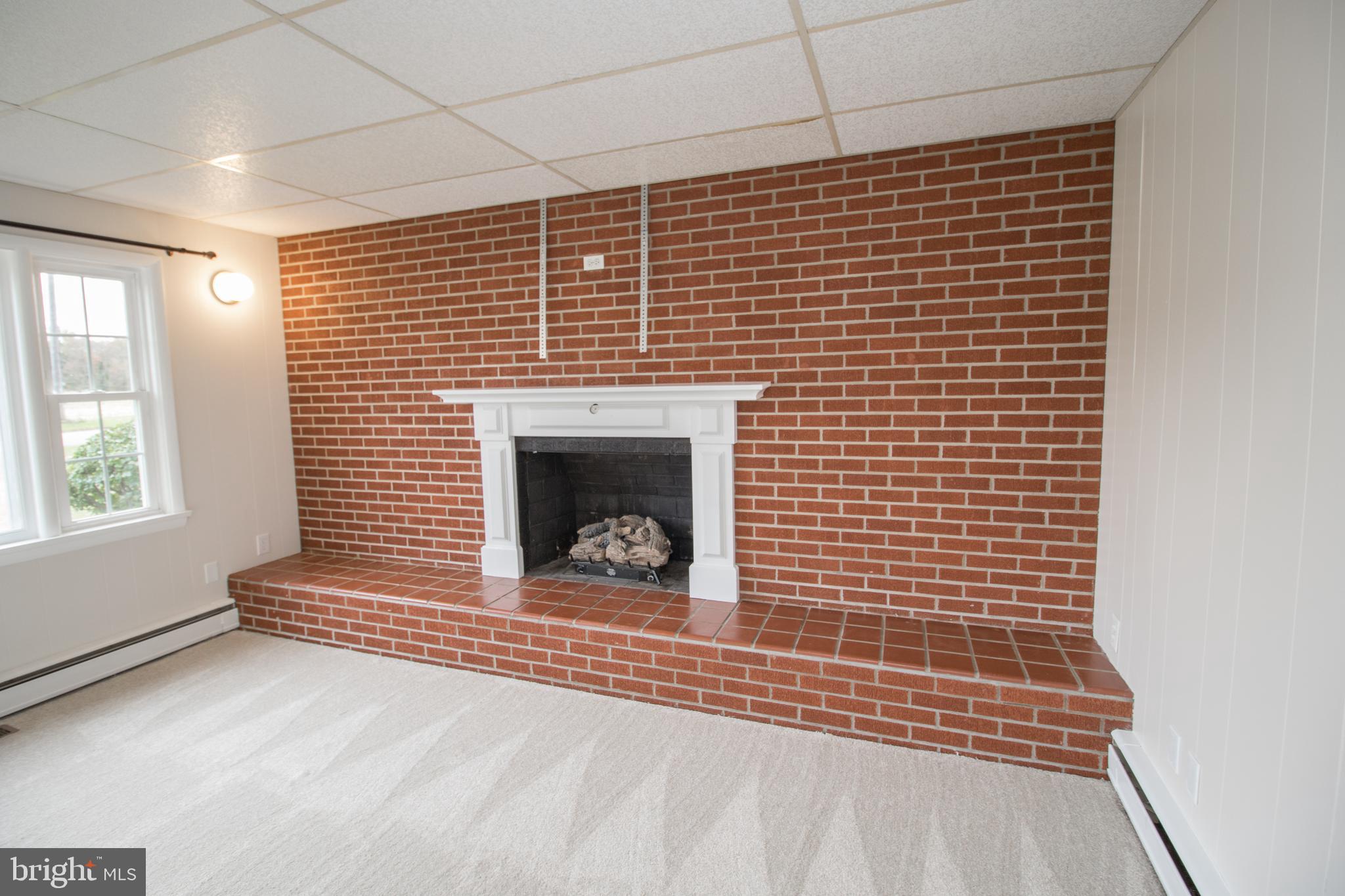 20697 Chingville Road Leonardtown, MD 20650 - Photo 44 of 87 a view of empty room with a fireplace