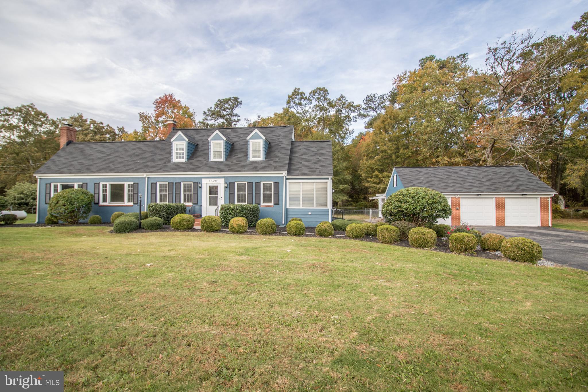 20697 Chingville Road Leonardtown, MD 20650 - Photo 5 of 87 a front view of a house with a garden and deck