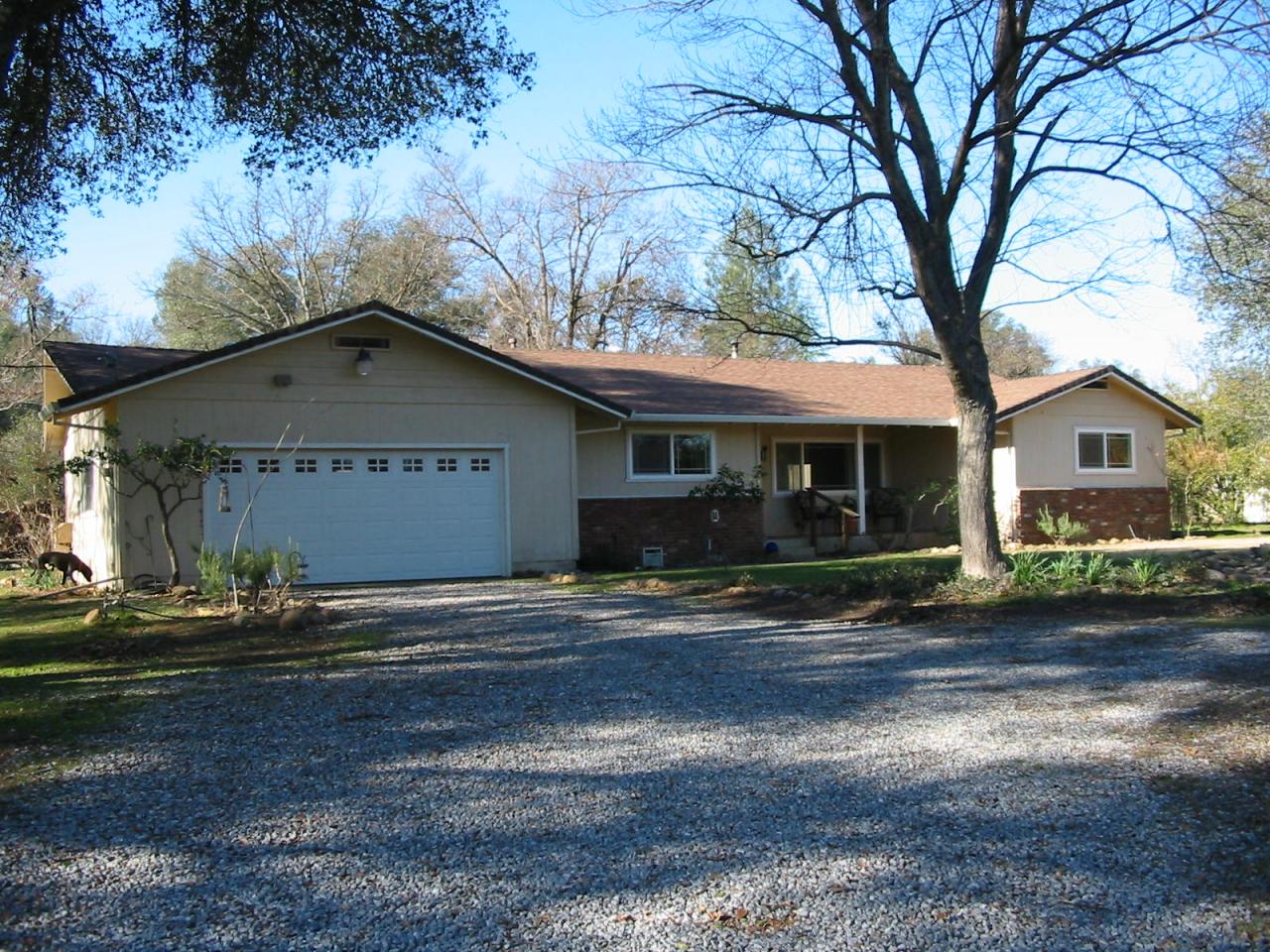 21334 Dersch Road Anderson, CA 96007 - Photo 2 of 24 a front view of a house with a yard