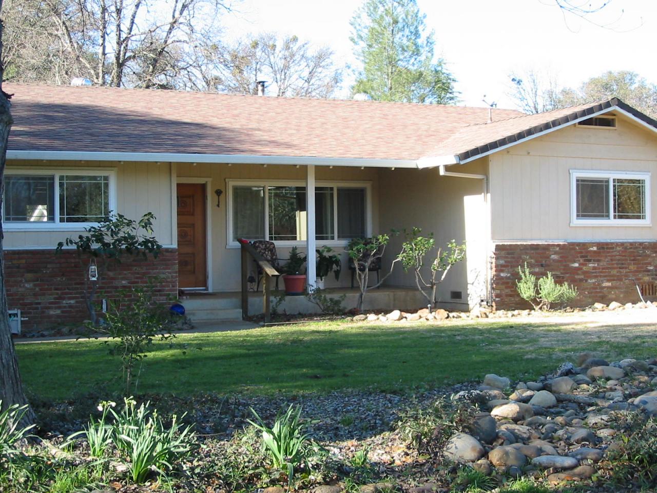 21334 Dersch Road Anderson, CA 96007 - Photo 3 of 24 a front view of a house with a yard and porch