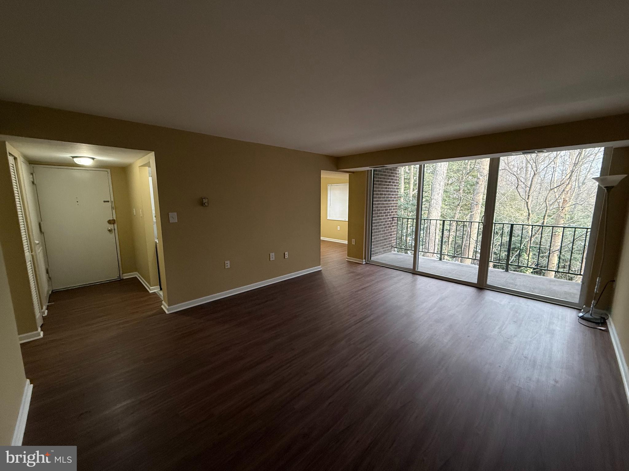 1403 Northgate Square, Unit 12B Reston, VA 20190 - Photo 2 of 16 an empty room with wooden floor and windows