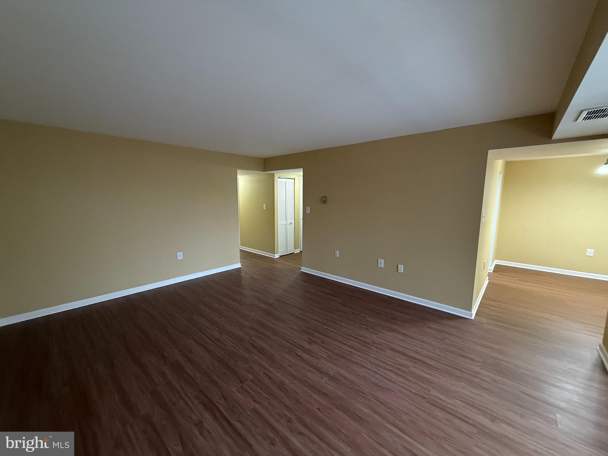 1403 Northgate Square, Unit 12B Reston, VA 20190 - Photo 4 of 16 a view of an empty room with wooden floor