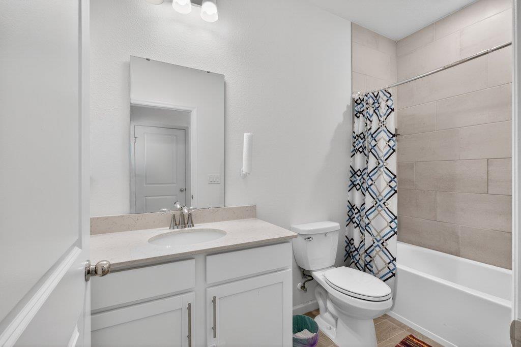 210 White Rabbit Run St. Augustine, FL 32092 - Photo 19 of 85 a bathroom with a sink toilet and shower