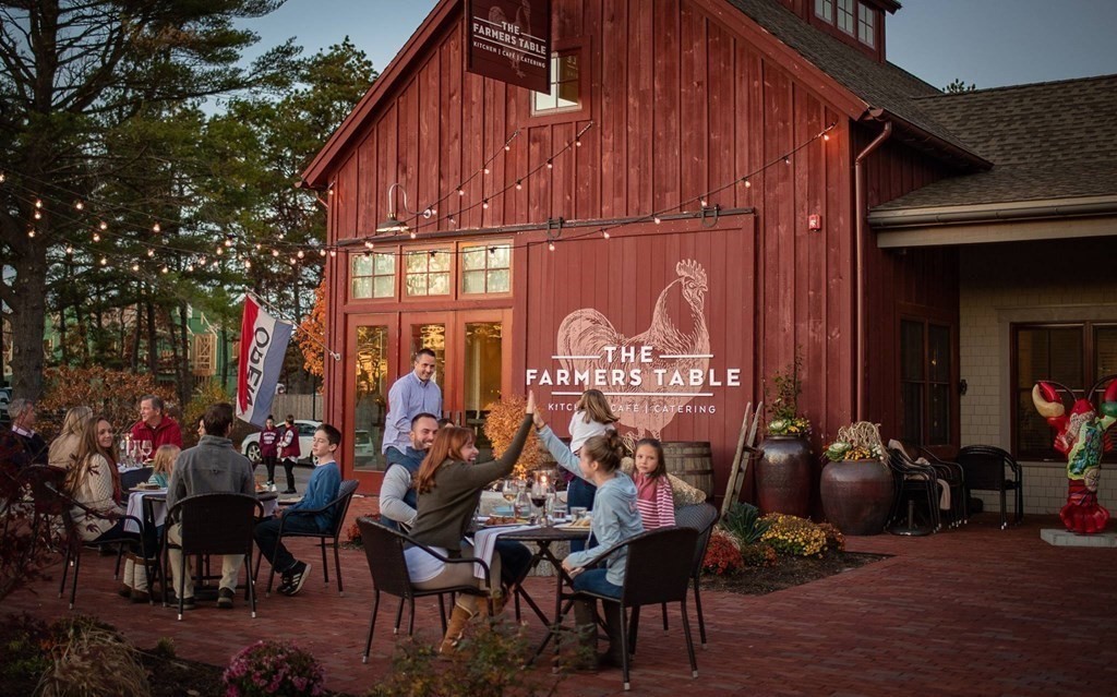 5 Farm Road Plymouth, MA 02360 - Photo 5 of 6 a group of people sitting in front of a building