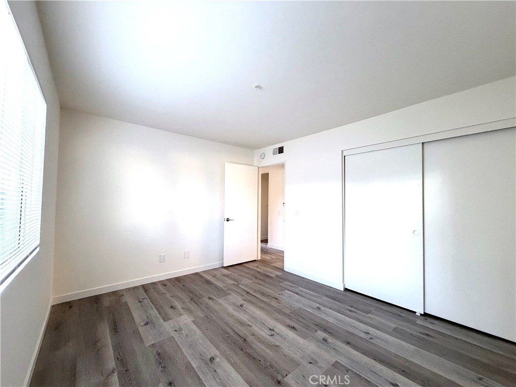 402 North Curtis Avenue, Unit A Alhambra, CA 91801 - Photo 12 of 12 a view of an empty room with wooden floor