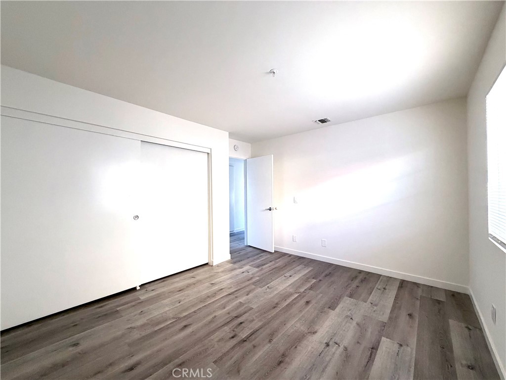402 North Curtis Avenue, Unit A Alhambra, CA 91801 - Photo 8 of 12 a view of an empty room with wooden floor