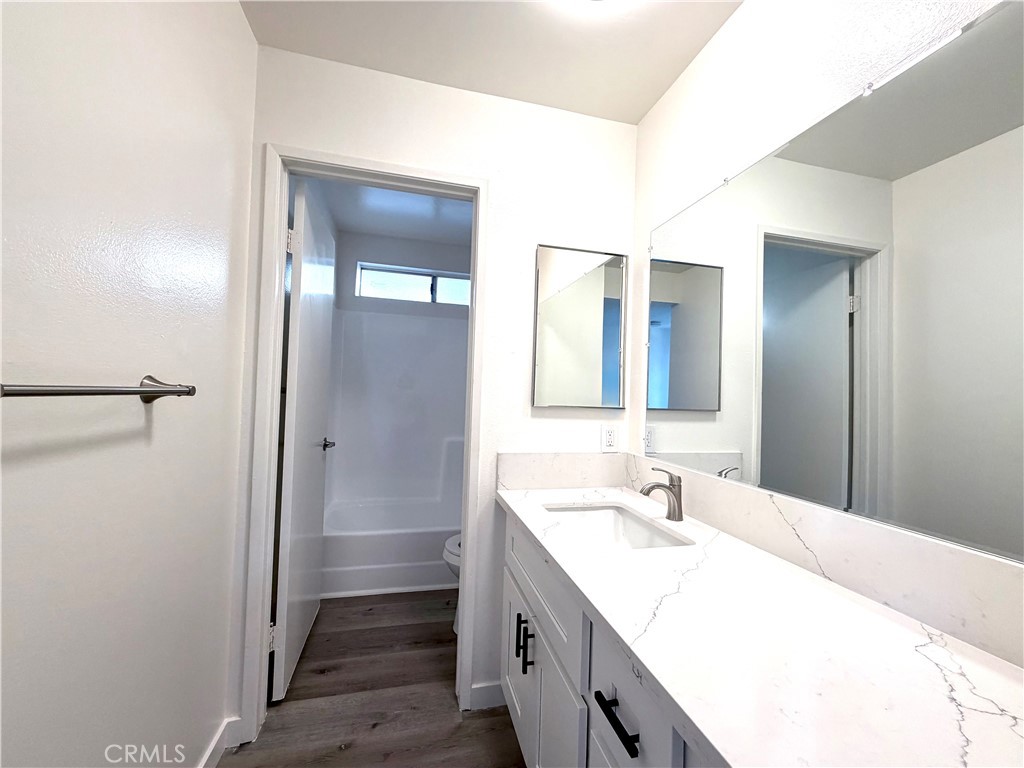 402 North Curtis Avenue, Unit A Alhambra, CA 91801 - Photo 10 of 12 a bathroom with a sink and a mirror