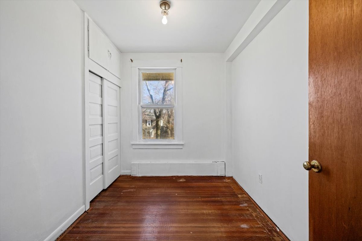 1206 Griffith Road Lake Forest, IL 60045 - Photo 9 of 16 a view of an empty room with wooden floor and a window