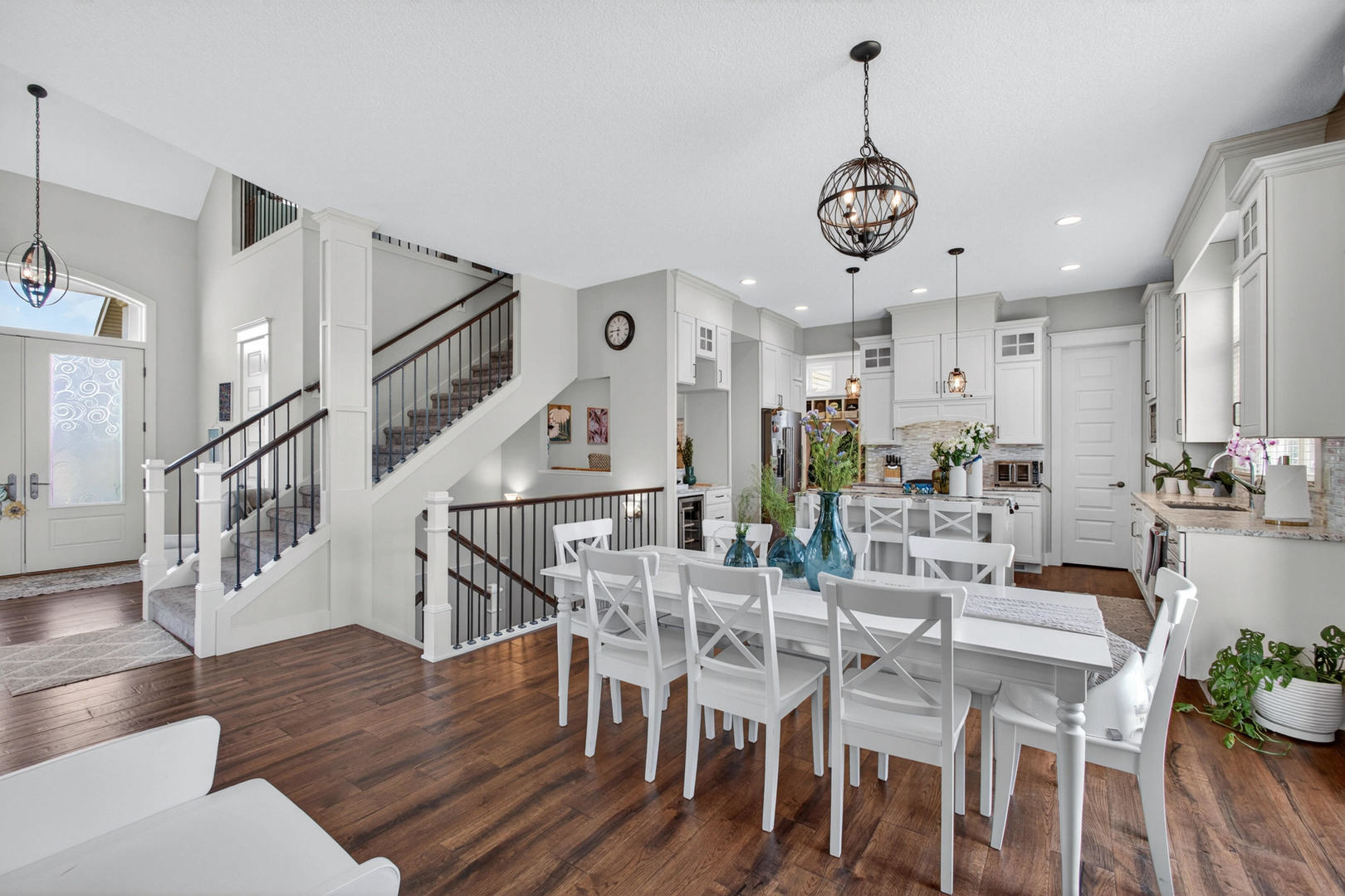 5700 Emily Road Bettendorf, IA 52722 - Photo 10 of 58 a view of dining room kitchen with furniture and wooden floor