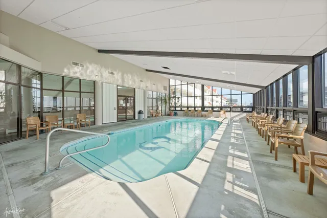 a view of a living room and a swimming pool