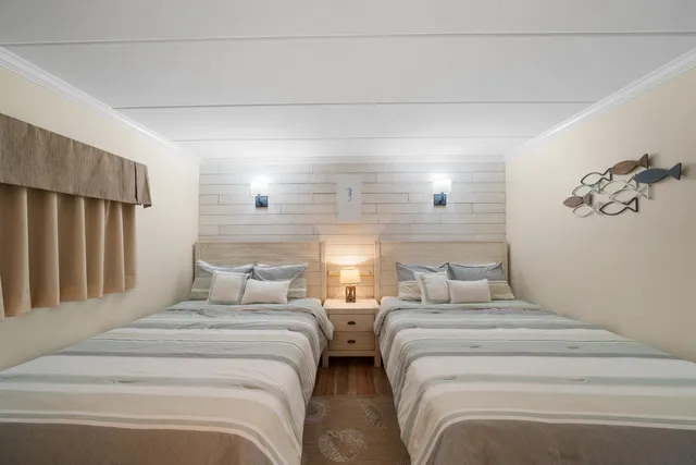 a bedroom with double bed and a window