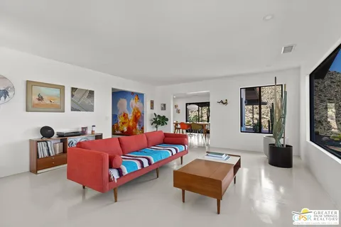 a bedroom with furniture and window