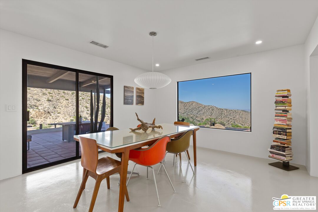 53744 Ridge Road Yucca Valley, CA 92284 - Photo 12 of 39 a dining room with furniture and a large window