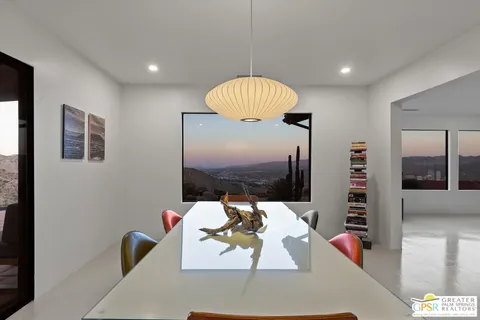 a room with furniture and a potted plant