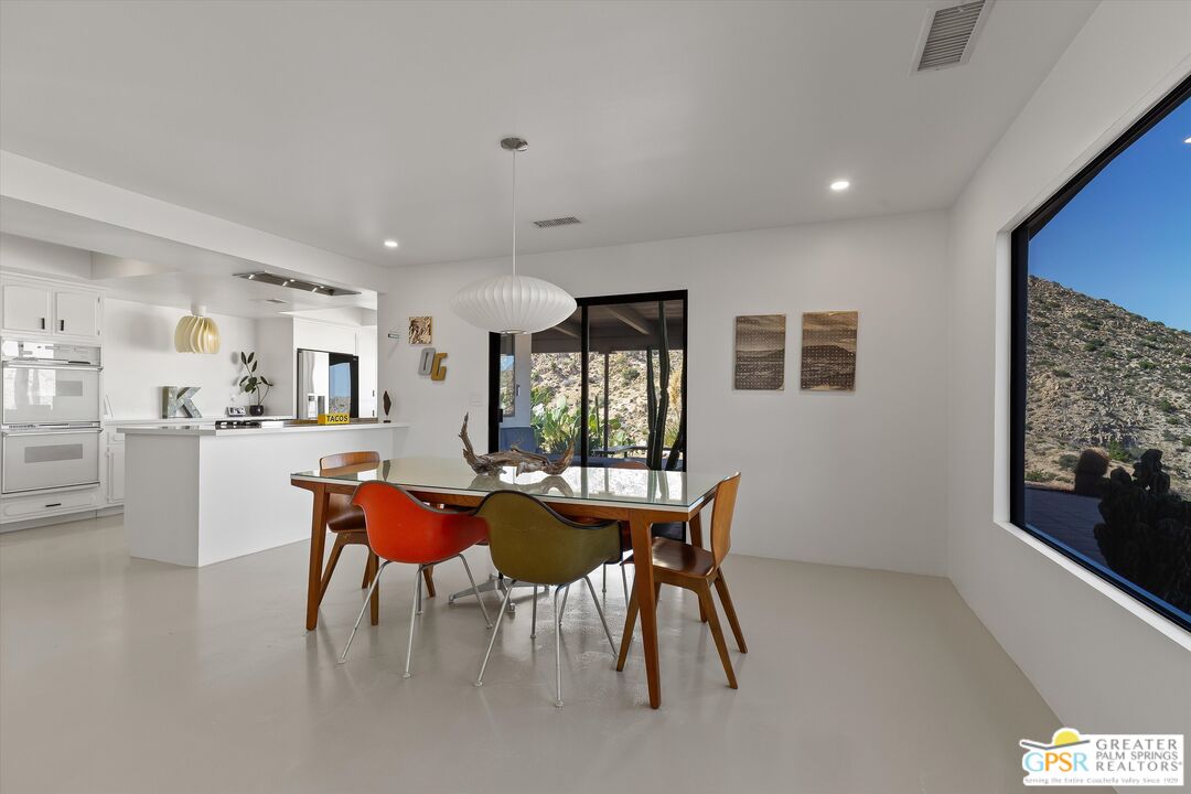 53744 Ridge Road Yucca Valley, CA 92284 - Photo 15 of 39 a dining room with furniture and window