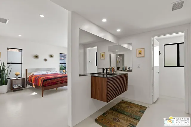 a bedroom with furniture and window