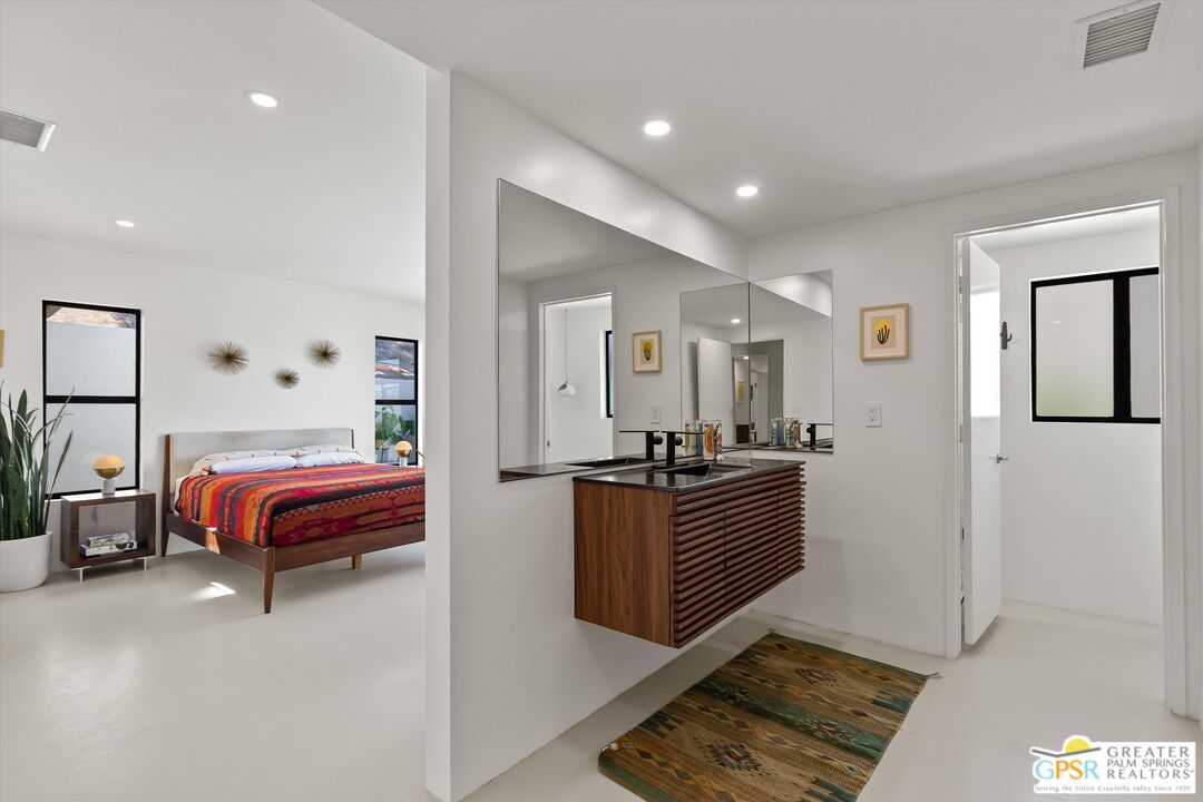 53744 Ridge Road Yucca Valley, CA 92284 - Photo 22 of 39 a bedroom with furniture and window