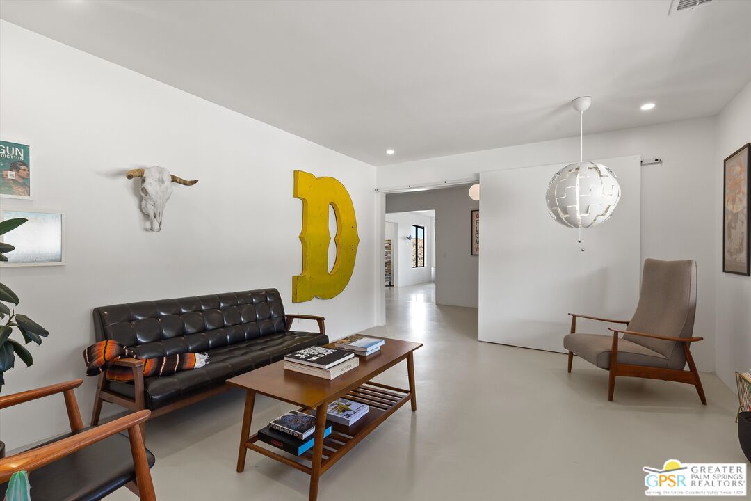 53744 Ridge Road Yucca Valley, CA 92284 - Photo 24 of 39 a living room with furniture and a mirror