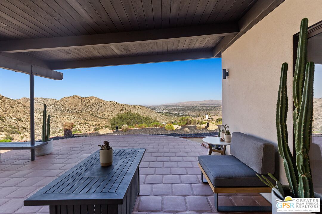 53744 Ridge Road Yucca Valley, CA 92284 - Photo 30 of 39 a view of living room with furniture and a floor to ceiling window