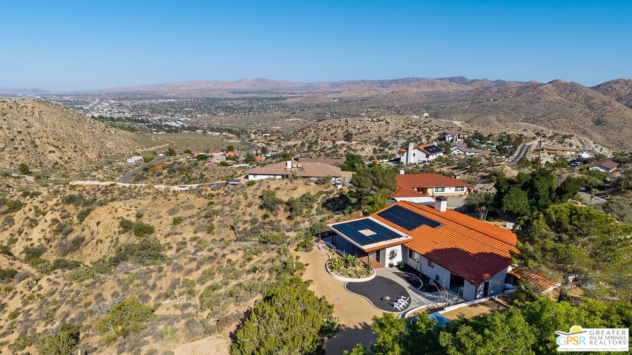 53744 Ridge Road Yucca Valley, CA 92284 - Photo 3 of 39 an aerial view of residential house with an outdoor space and seating