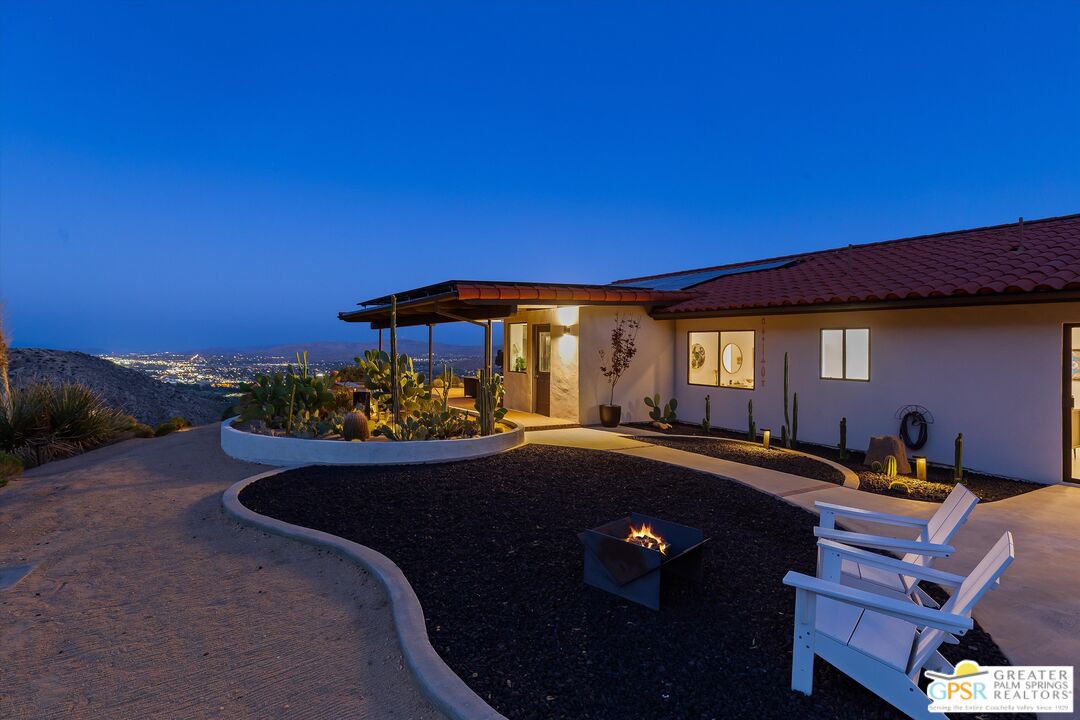 53744 Ridge Road Yucca Valley, CA 92284 - Photo 33 of 39 a view of a patio with swimming pool table and chairs