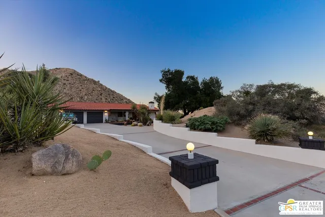 a view of a street with a building in the background