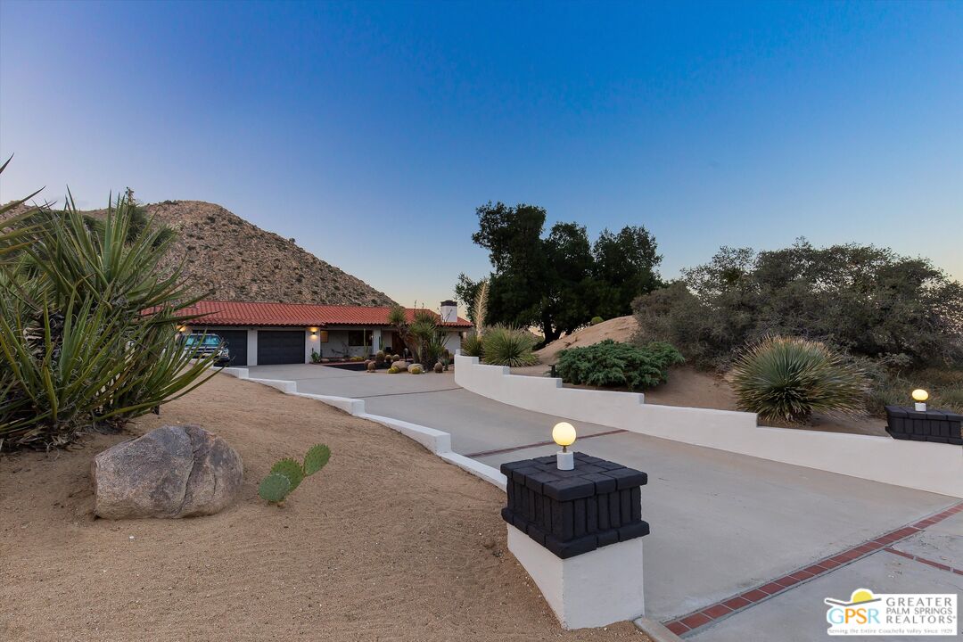 53744 Ridge Road Yucca Valley, CA 92284 - Photo 36 of 39 a view of a street with a building in the background
